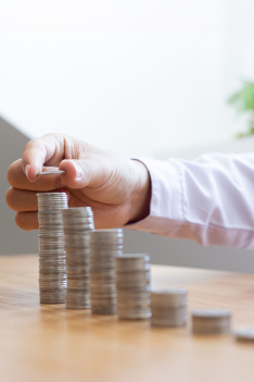 Young,Independent,Woman,Relaxing,On,Grass,In,Park