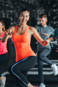 Young,Independent,Woman,Relaxing,On,Grass,In,Park